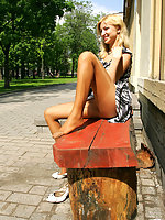 Cutie in tan pantyhose getting the most from flashing upskirt on the bench