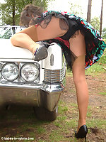 Leggy brunette outdoor in vintage dress and tan stockings !