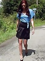 This cheeky brunette goes for a walk outdoors wearing some very sexy nylons