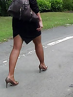 In brown high heels and  tights Kathryn walks be beneficial to all you lucky chaps who need girls like her