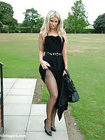 Beautiful blonde dressed in black and showing off her high heels